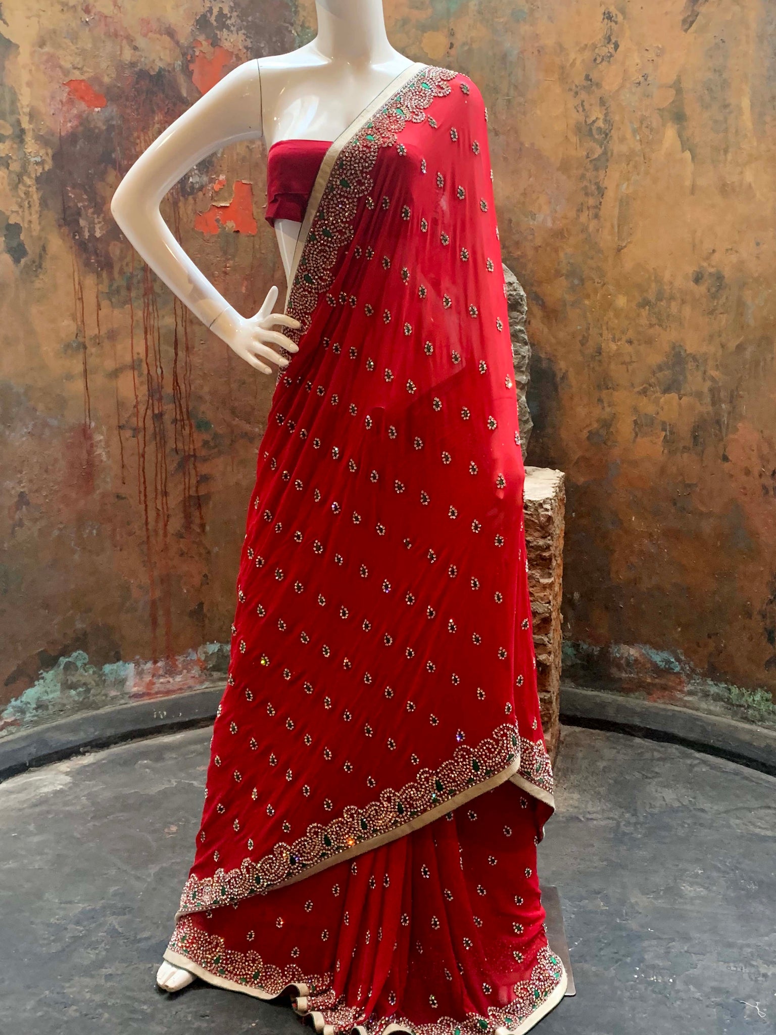 Deep red fully embellished georgette saree